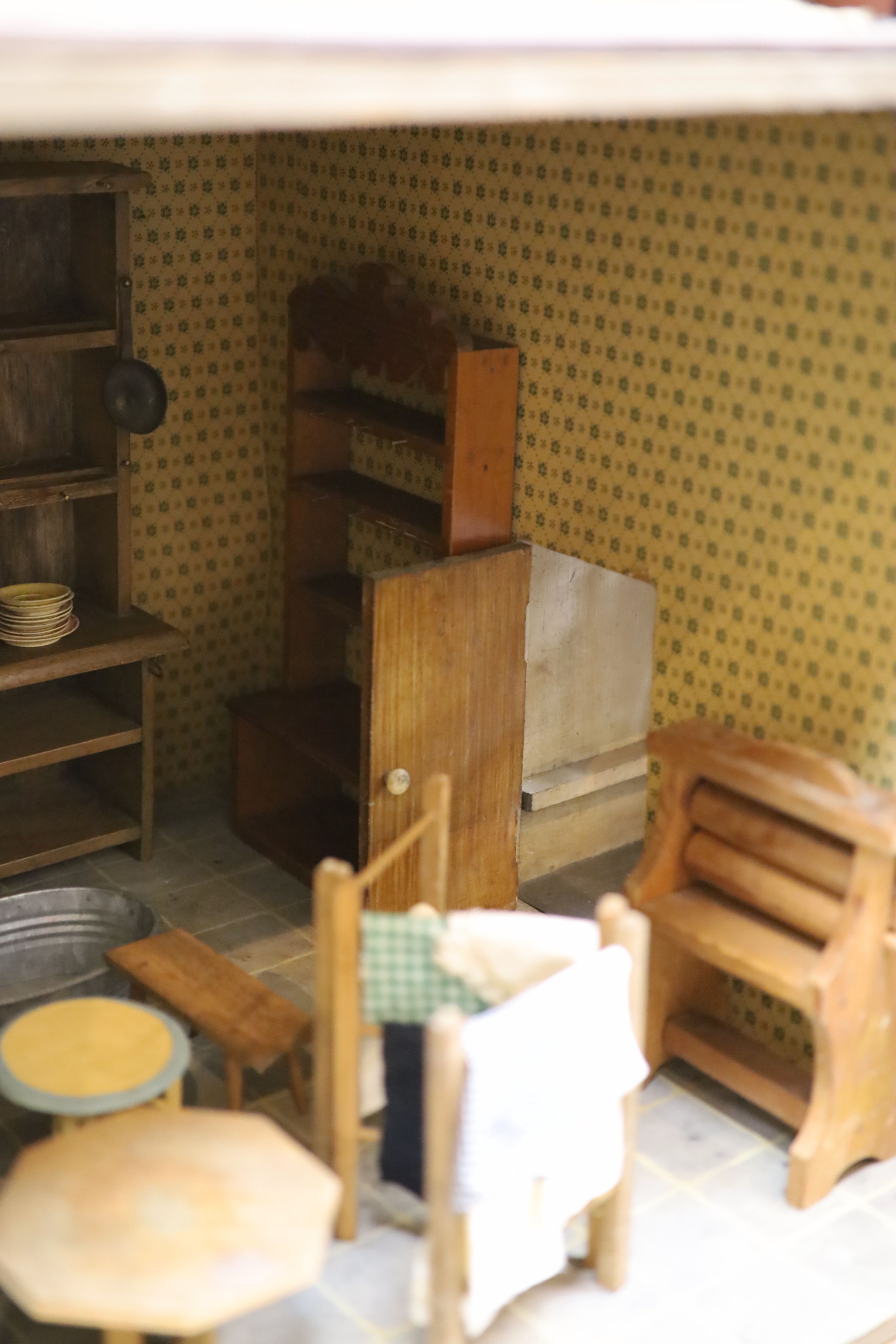 An unusually large painted pine doll's house, modelled upon a Victorian lodge house, Estate Carpenter made, Lake District width 198cm height 156cm